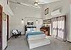 Relax and recharge in this cozy queen bedroom retreat with patio access.