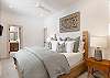 The primary suite located on the main level offers a serene retreat with its own en-suite bath and an attached study 