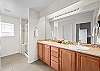 Spacious ensuite bathroom with dual vanity and walk-in shower.