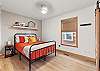 Bright and clean queen bedroom, perfect for a comfortable stay – sleeps 2. 