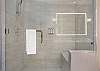 Full bathroom featuring a sleek walk-in shower.