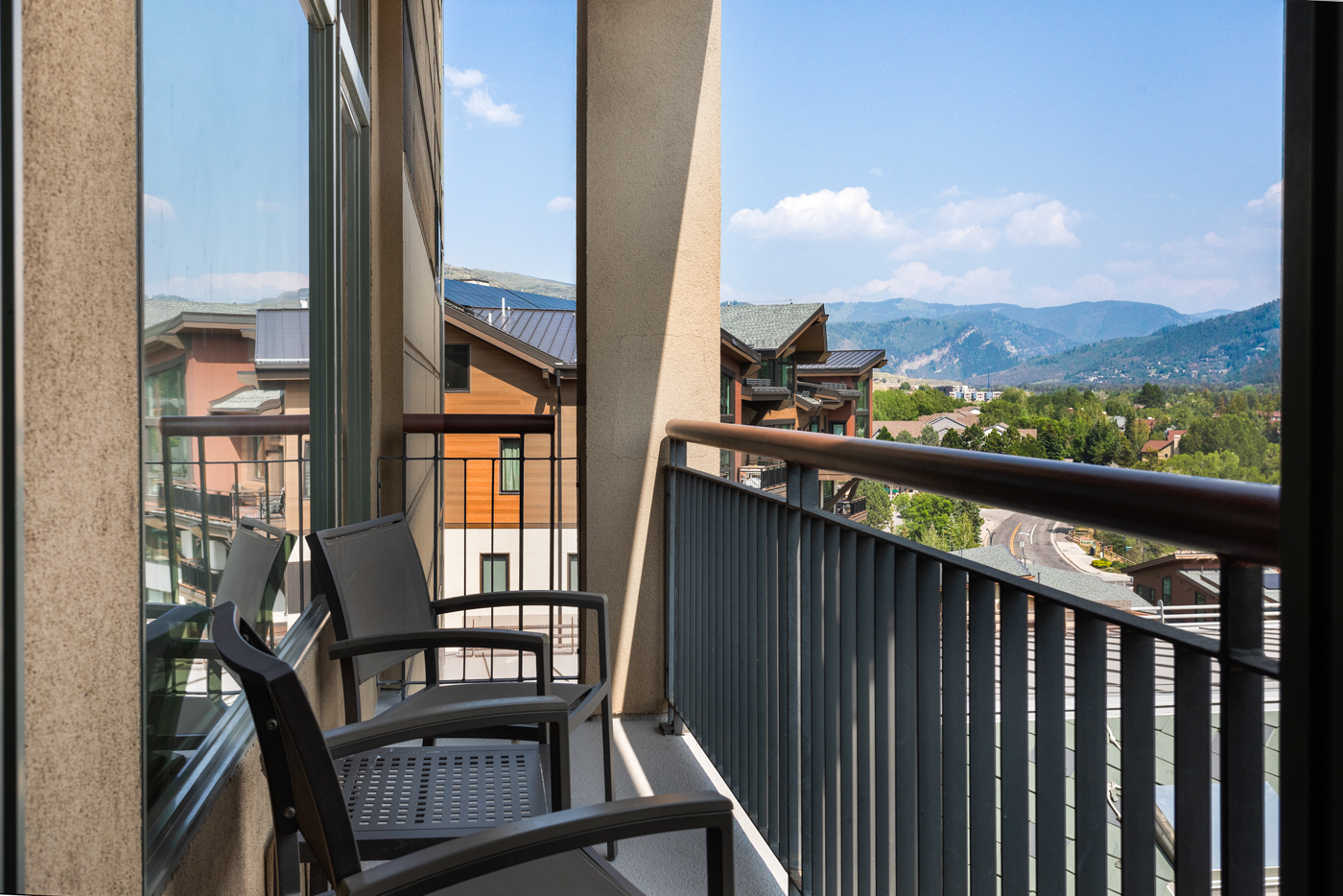 Enjoy the panoramic mountain views on the balcony.