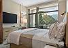 Unwind in this spacious king bedroom with a Smart TV and desk.