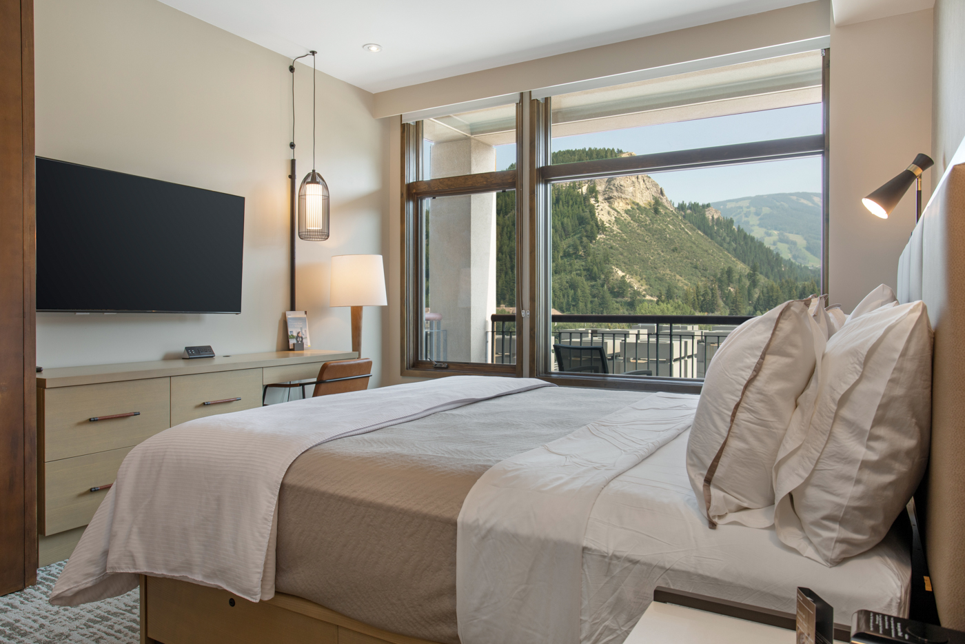Unwind in this spacious king bedroom with a Smart TV and desk.
