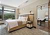 Unwind in this spacious king bedroom with a Smart TV and desk.