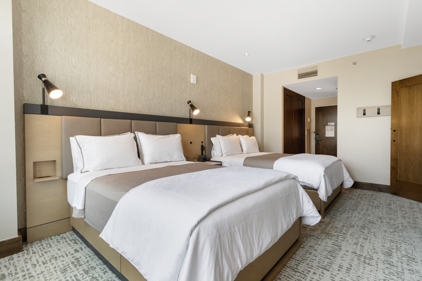 Bright and clean double-queen bedroom, perfect for a comfortable stay.