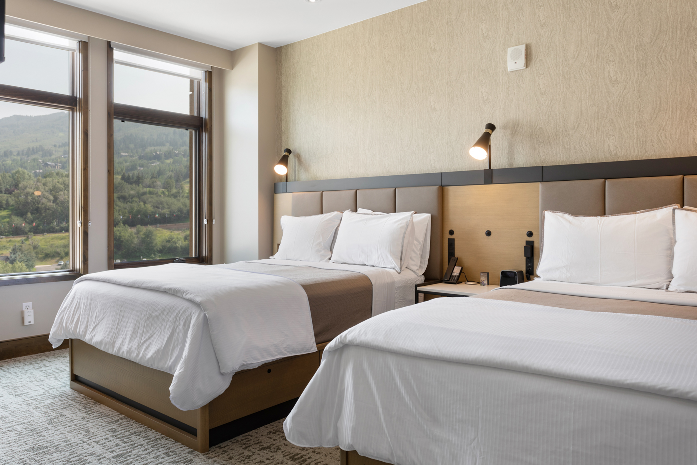 Bright and clean double-queen bedroom, perfect for a comfortable stay.