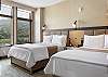 Bright and clean double-queen bedroom, perfect for a comfortable stay.