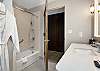 Clean and functional bathroom featuring a tub/shower combination.