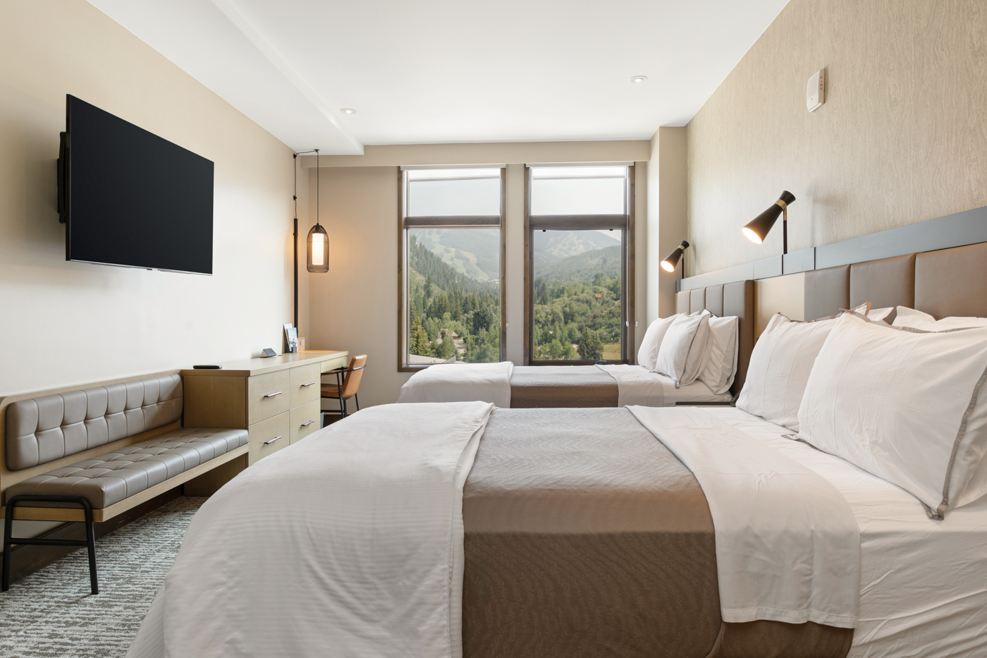 Unwind in this double-queen bedroom with a Smart TV—comfort and entertainment in one. 