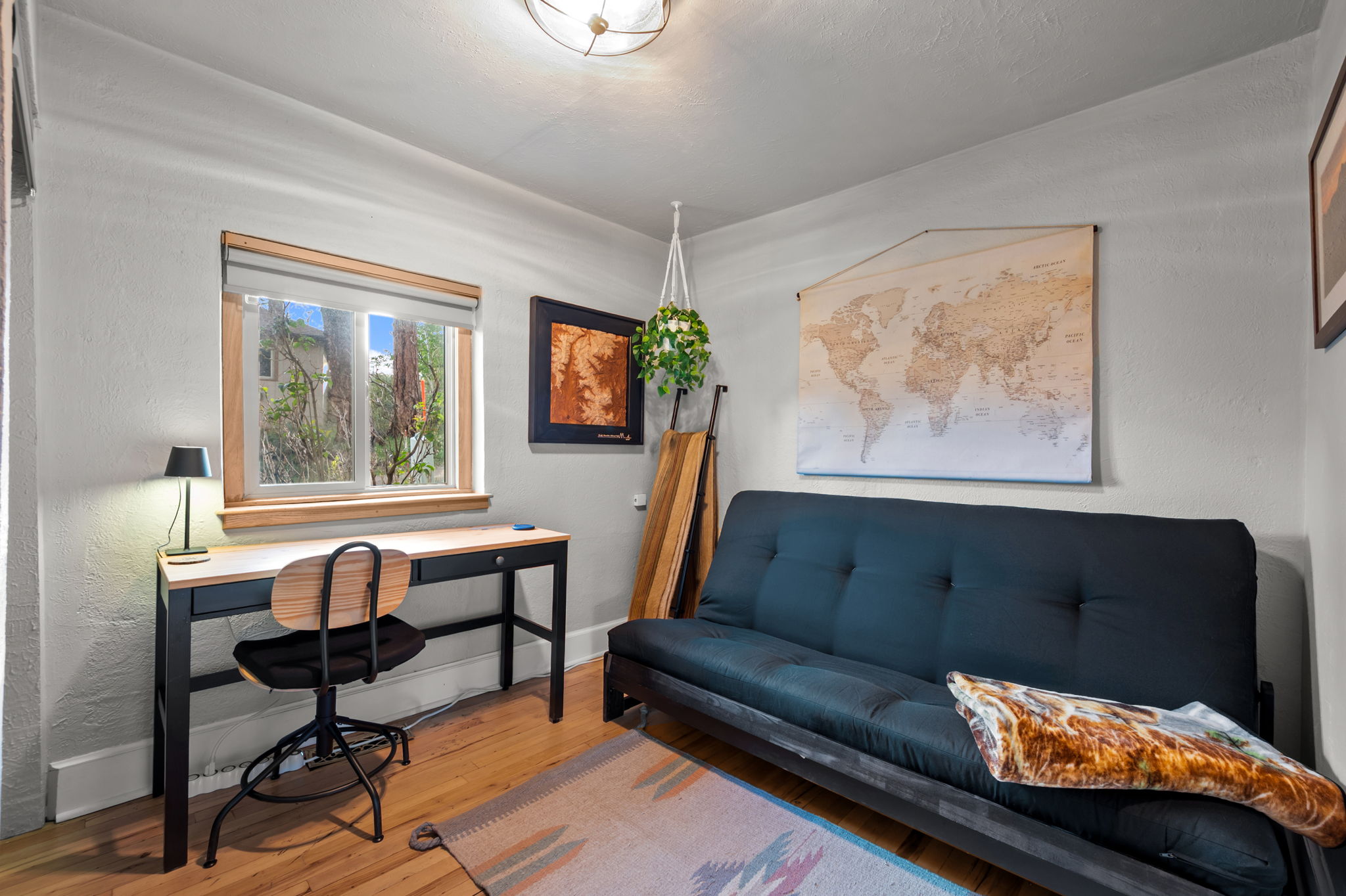 Working remotely or need a little extra sleeping space? This cozy room has a futon and dedicated desk to cover both.