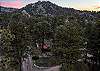 Tucked into the pines with a rocky peak as your backdrop — this is your home base for the mountains.
