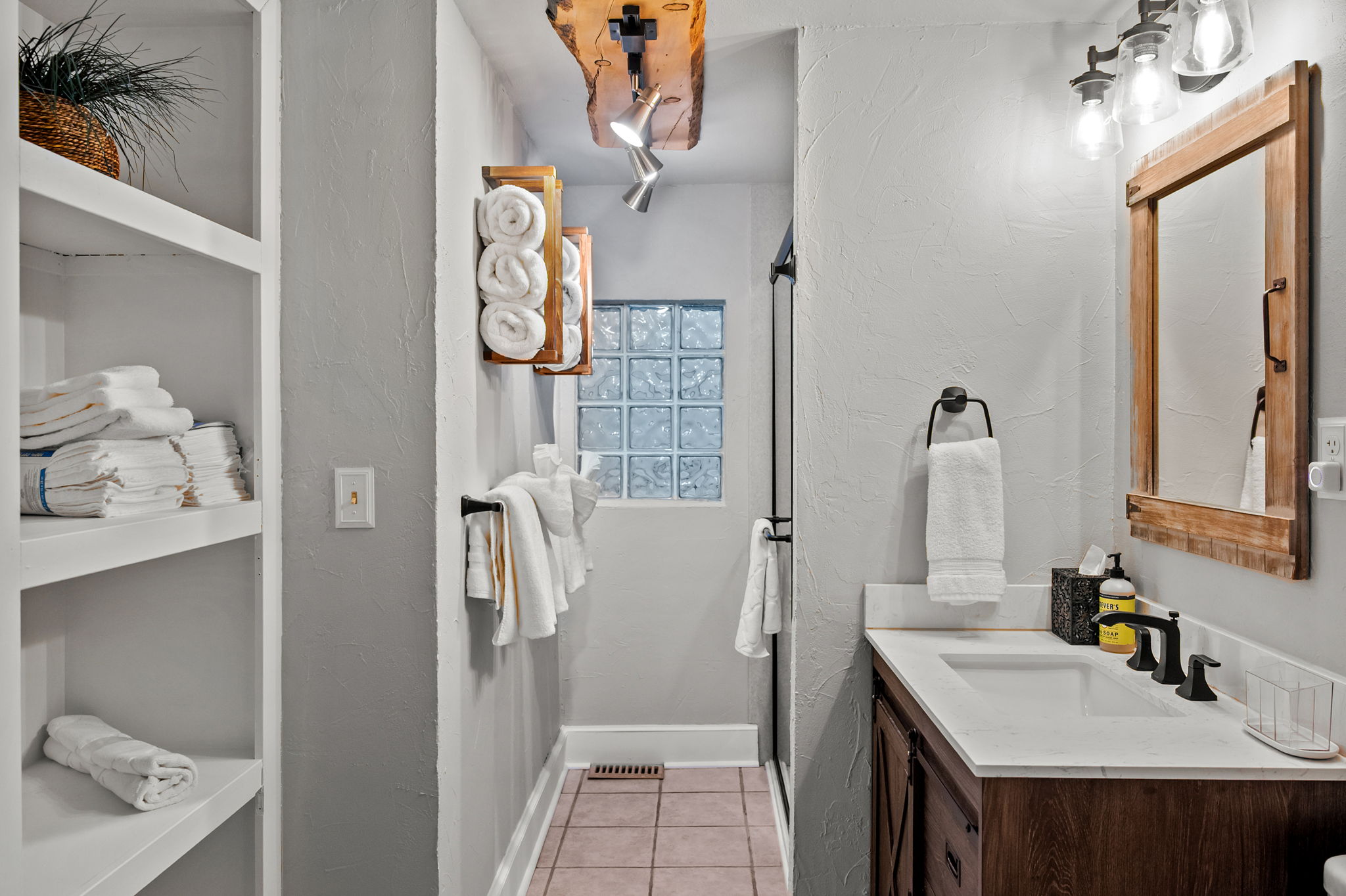 Full bathroom featuring a sleek walk-in shower.