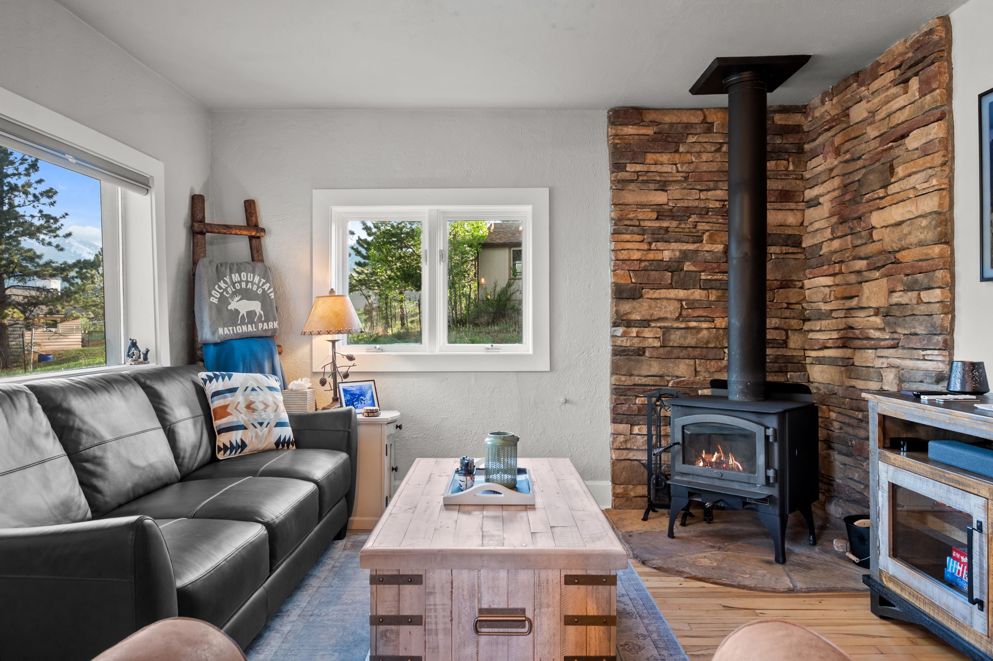 Sink into the leather sofa with the wood stove glowing and the Smart TV queued up. A perfect end to a trail day.