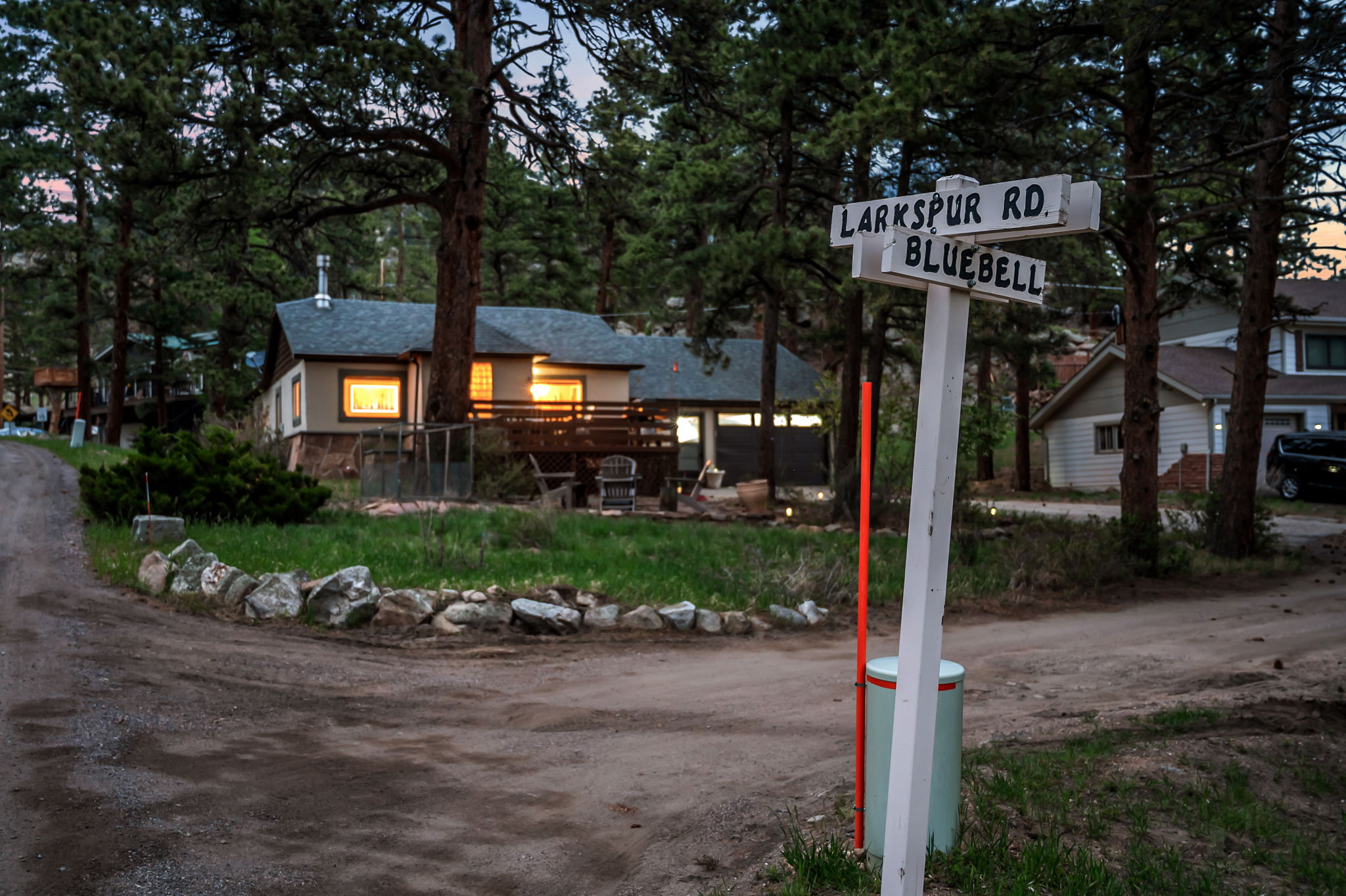 Tucked into the pines with a rocky peak as your backdrop — this is your home base for the mountains.