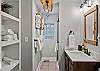 Full bathroom featuring a sleek walk-in shower.