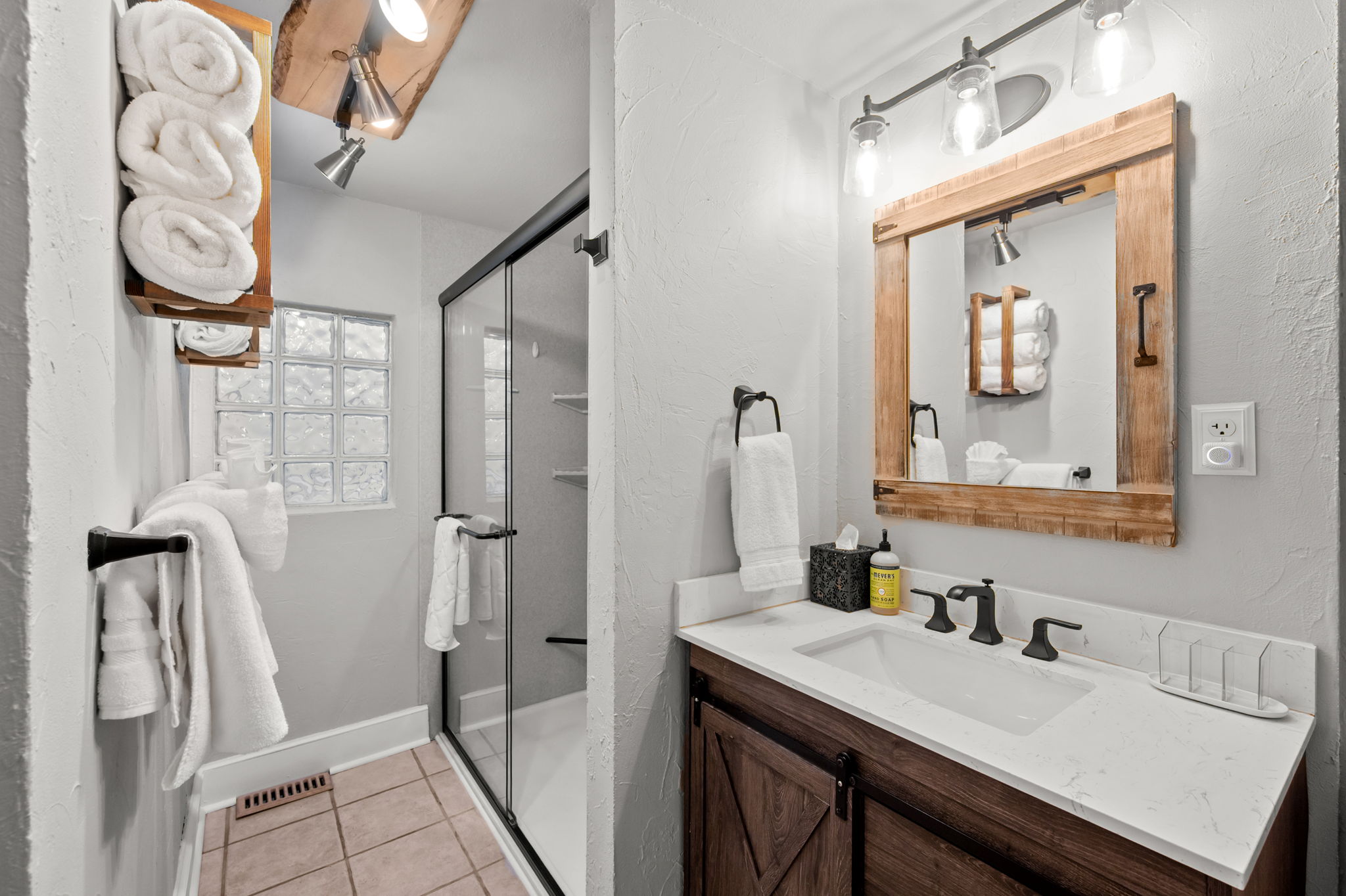 Full bathroom featuring a sleek walk-in shower.