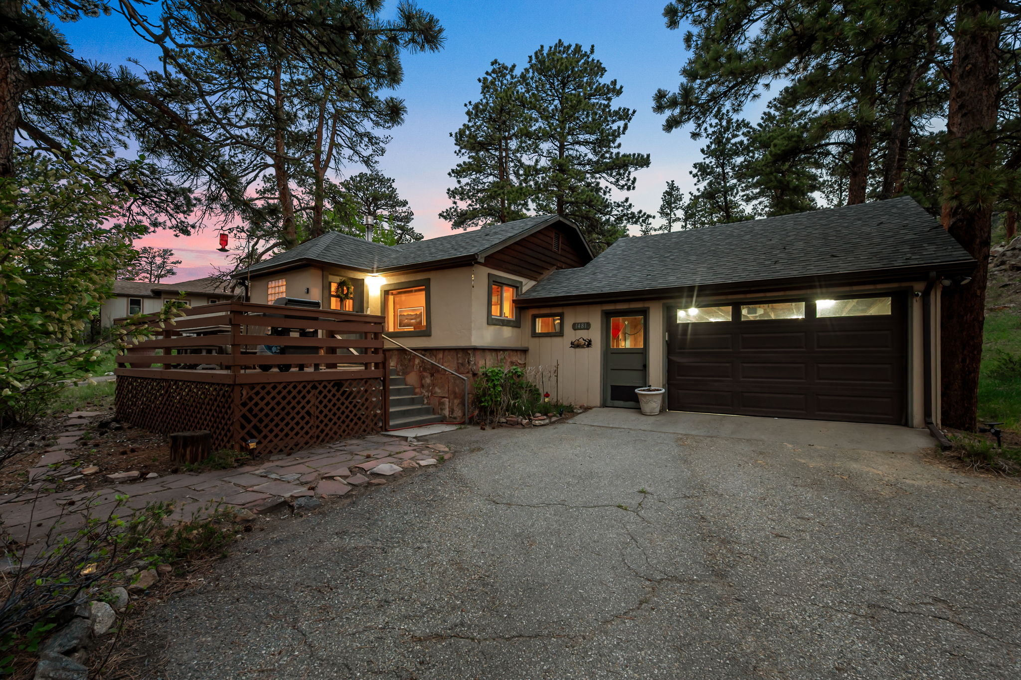 Tucked into the pines with a rocky peak as your backdrop — this is your home base for the mountains.