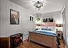 Relax and recharge in this cozy queen bedroom retreat.