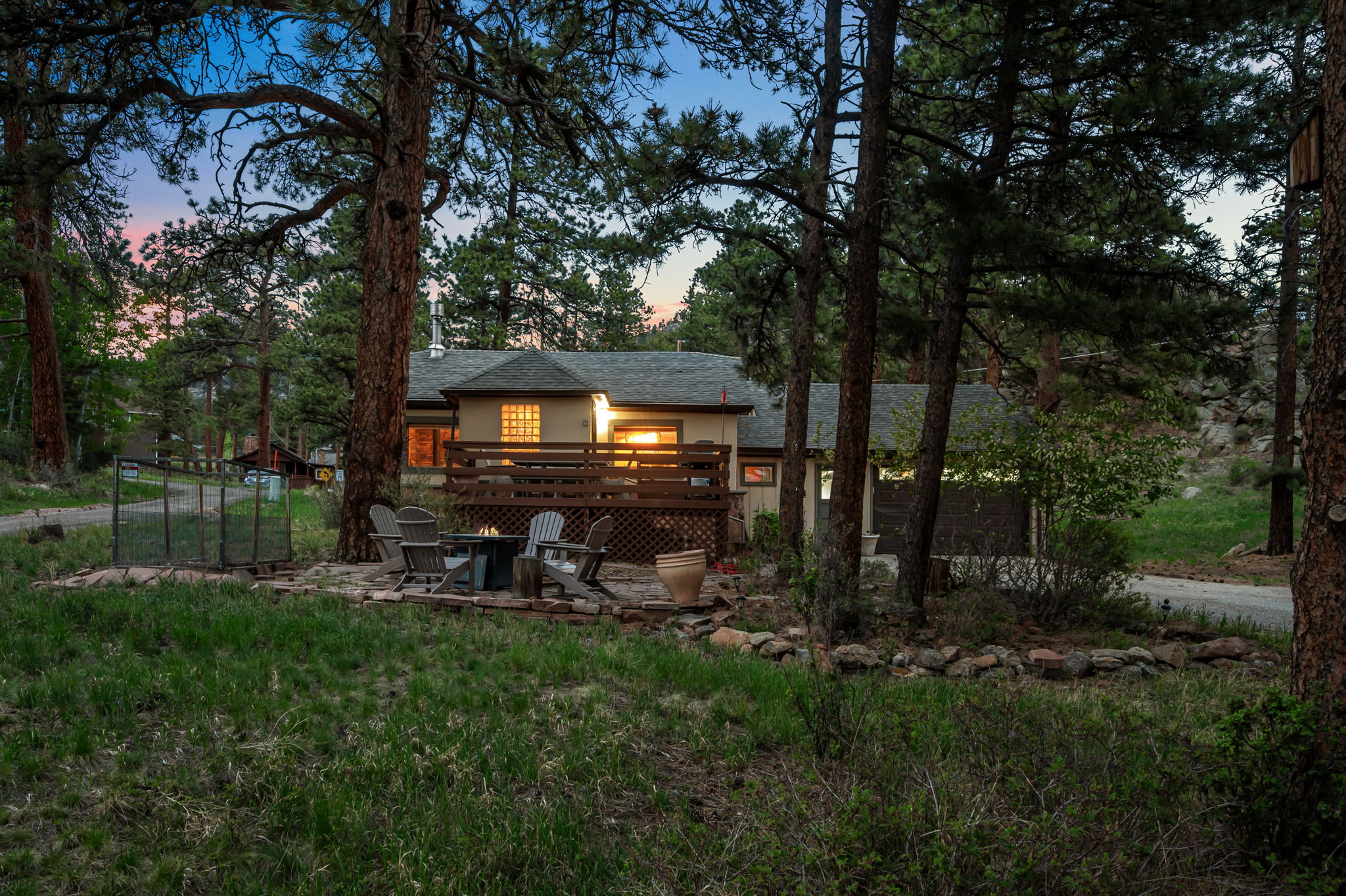 Tucked into the pines with a rocky peak as your backdrop — this is your home base for the mountains.