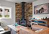 Sink into the leather sofa with the wood stove glowing and the Smart TV queued up. A perfect end to a trail day.