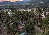 Tucked into the pines with a rocky peak as your backdrop — this is your home base for the mountains.