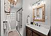 Full bathroom featuring a sleek walk-in shower.