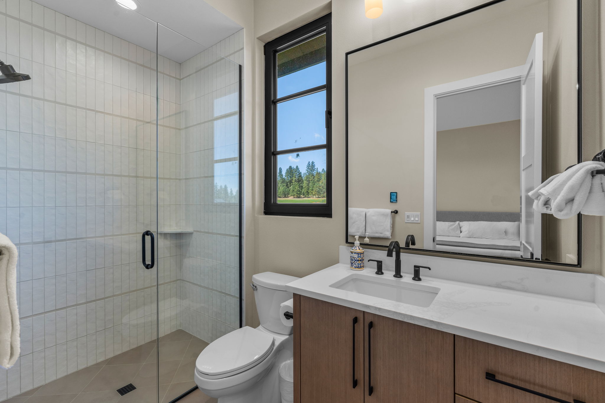 Full bathroom with walk-in shower.