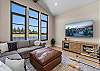Game on. The media room features a queen sleeper sofa, large Smart TV, Xbox, and foosball table — the perfect wind-down after a day on the lake.