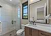 Full bathroom with walk-in shower.