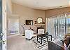 Cozy up in style! This living room is perfect for relaxation and gathering. Features a gas log fireplace and smart TV. 