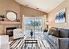Cozy up in style! This living room is perfect for relaxation and gathering. Features a gas log fireplace and smart TV. 