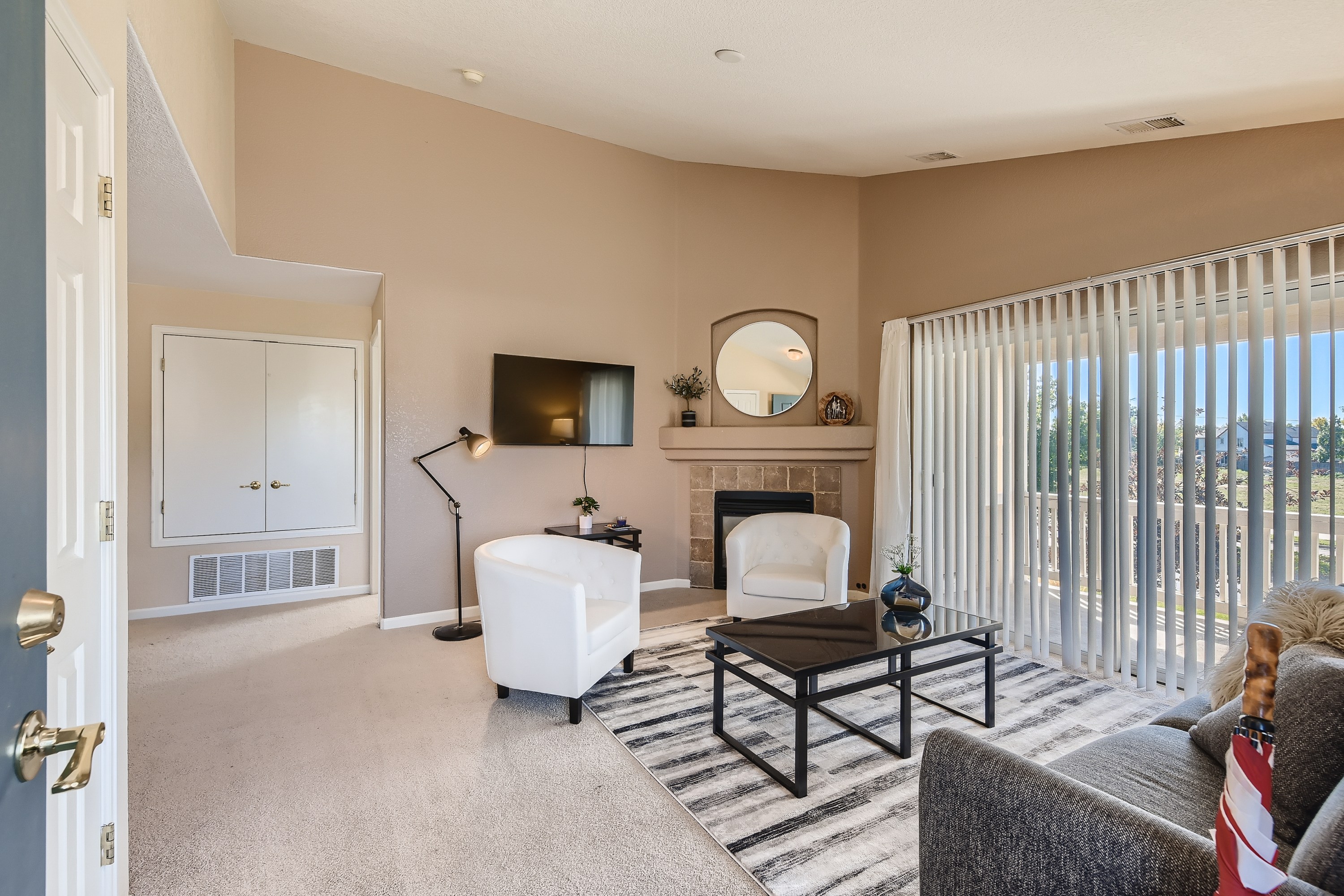 Cozy up in style! This living room is perfect for relaxation and gathering. Features a gas log fireplace and smart TV. 