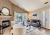 Cozy up in style! This living room is perfect for relaxation and gathering. Features a gas log fireplace and smart TV. 