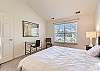 King bedroom with a desk for remote working. 