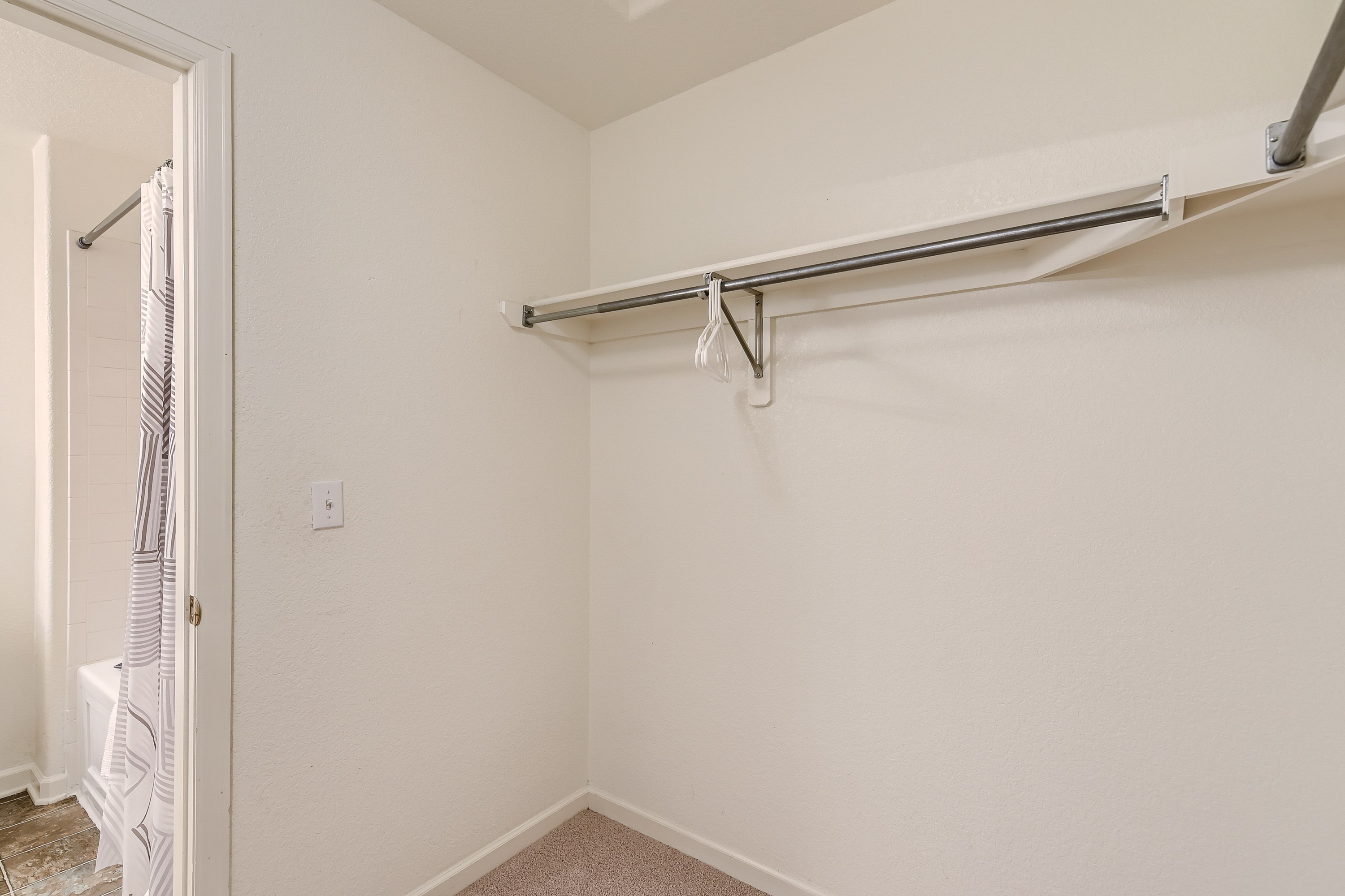 Walk-in closet connected to the master bedroom. 