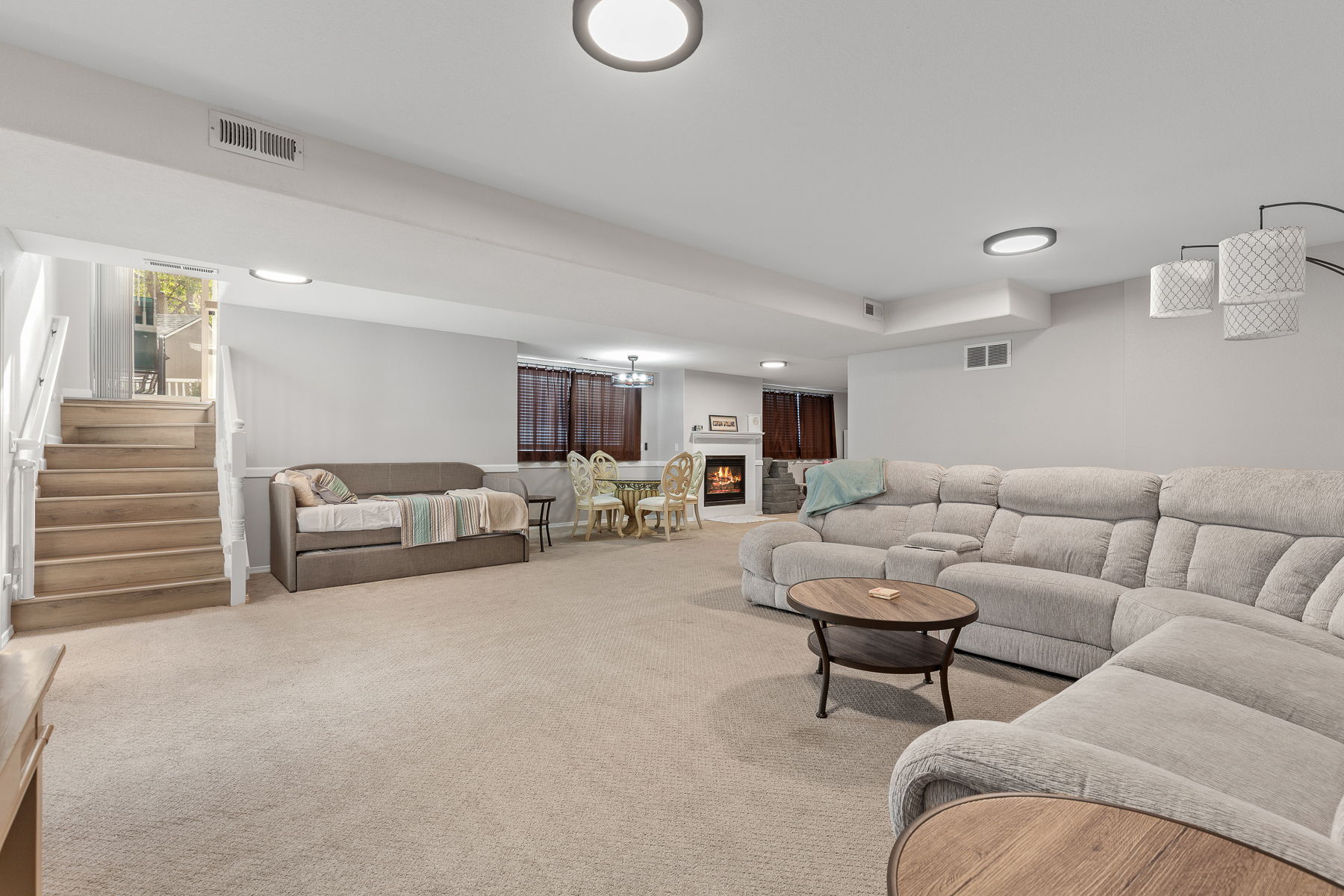 Living Room 2: Lower level living room with large smart TV and plenty of seating. 