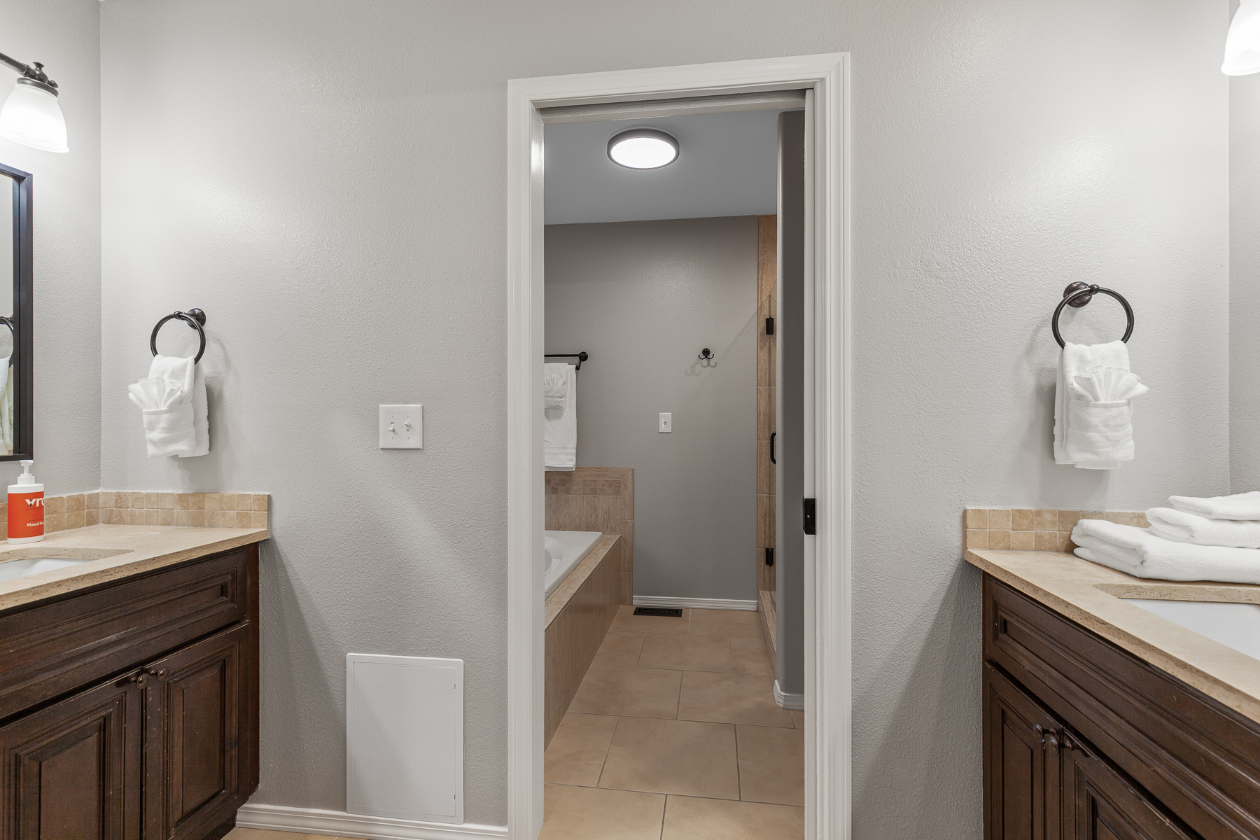 Main King bedroom ensuite bathroom with tub and walk-in shower.