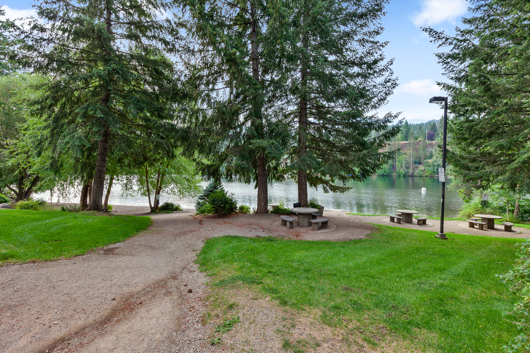 Community park — complete with a playground, picnic area, walking trails, and a private beach area on the Spokane River.