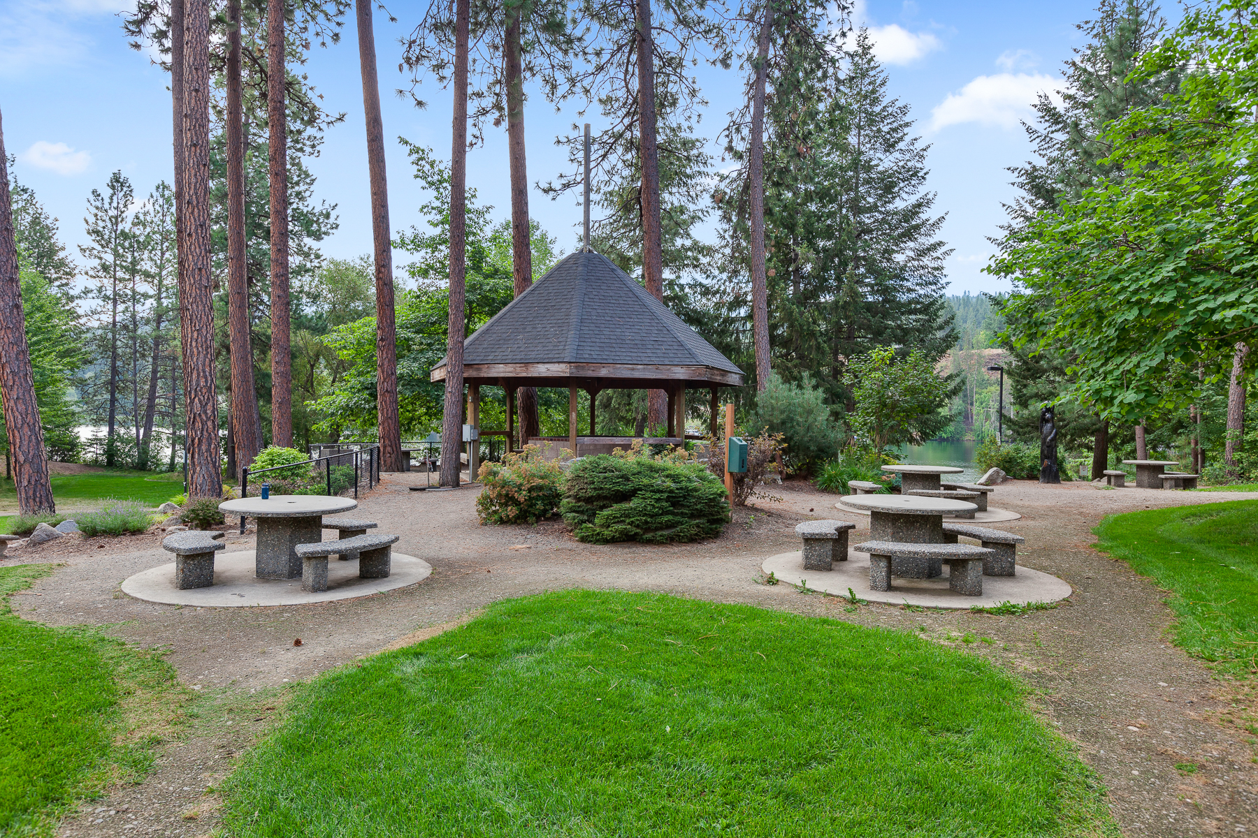 Community park — complete with a playground, picnic area, walking trails, and a private beach area on the Spokane River.