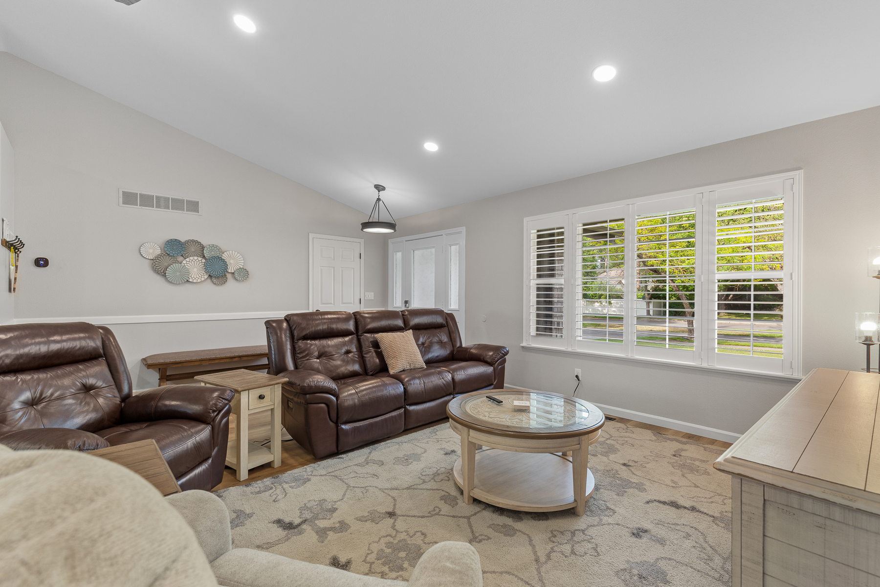 Living Room 1: Upper level living room with large smart TV and plenty of seating. 