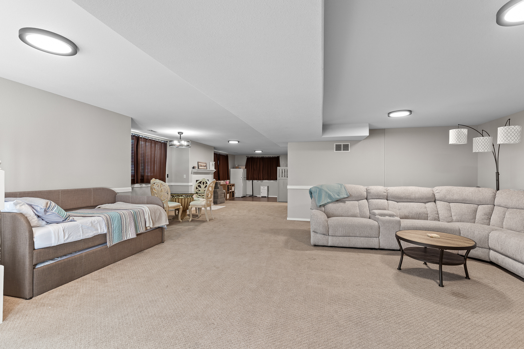 Living Room 2: Lower level living room with large smart TV and plenty of seating. 