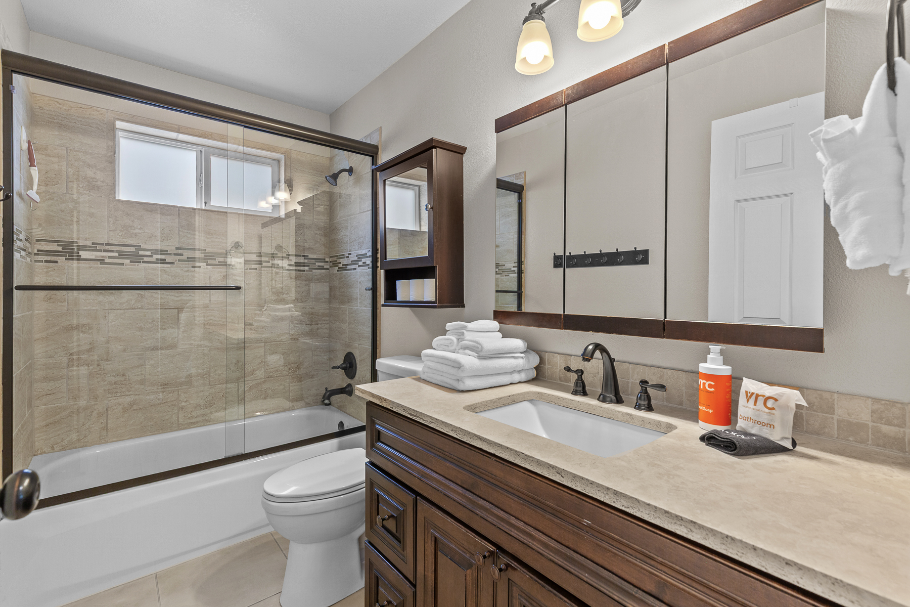 Full guest bathroom #1 with convenient tub/shower combo.