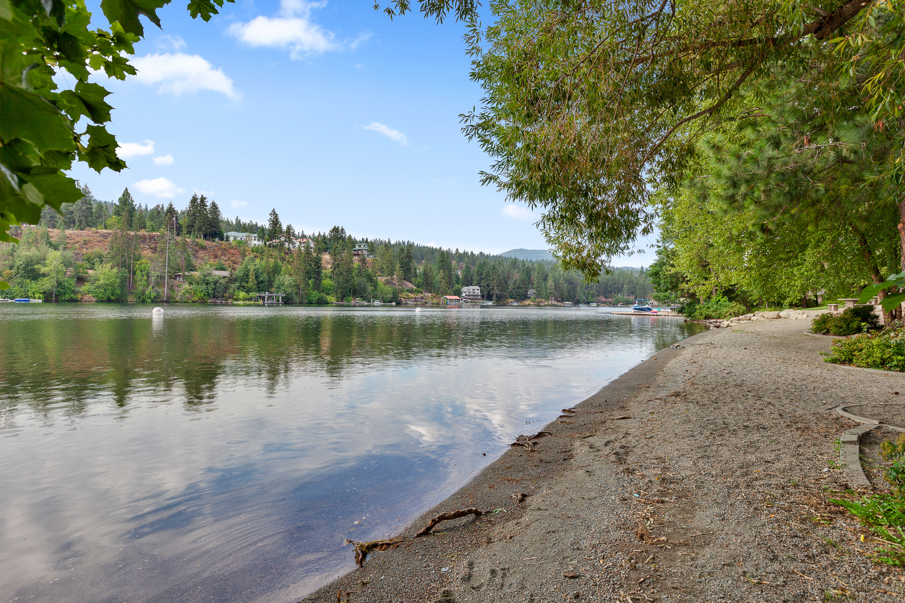 Community park — complete with a playground, picnic area, walking trails, and a private beach area on the Spokane River.