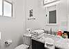 Enjoy the convenience of a walk-in shower in this well-appointed bathroom.