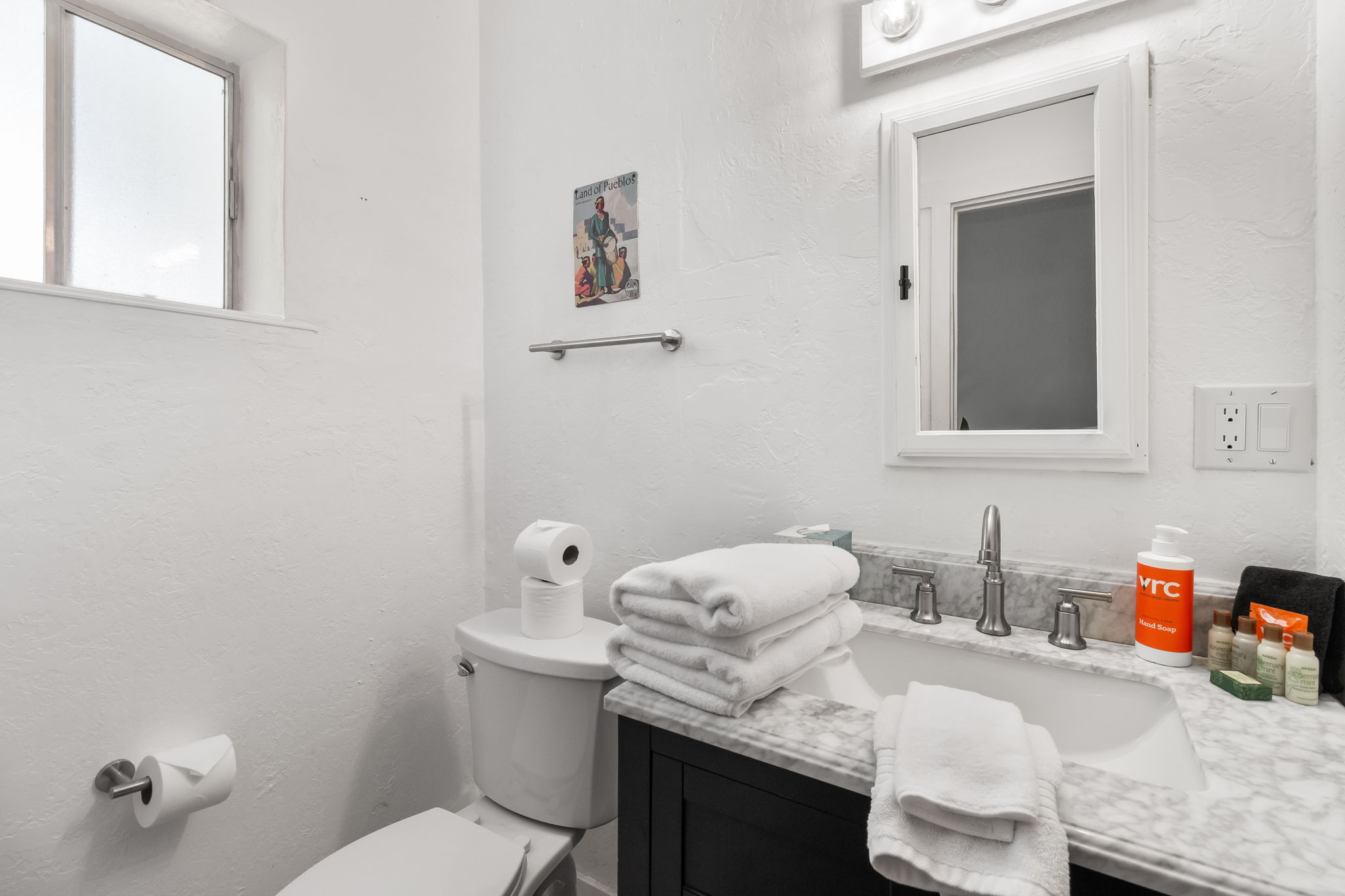 Enjoy the convenience of a walk-in shower in this well-appointed bathroom.