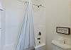 Jack-n-Jill bathroom with tub/shower combo on the upper level. 