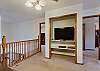 Upstairs loft equipped with a Smart TV. 
