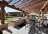 Community grill and patio area. 