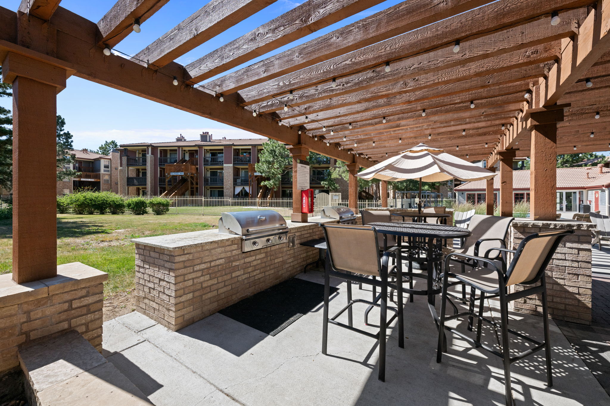 Community grill and patio area. 